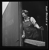 [Untitled photo, possibly related to: Pitcairn, Pennsylvania. Mrs. Lois Micheltree, thirty-six, employed as a laborer at the Pennsylvania Railroad lumber yard, earning fifty-five cents per hour. She helps to load and unload lumber from cars. She has a son in the United States Navy]. Sourced from the Library of Congress.