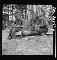 [Untitled photo, possibly related to:  Spring pulpwood drive on the Brown Company timber holdings in Maine. Mid-afternoon "lunch" by Long Pond where woodsmen are sluicing. On the menu that day: roast pork and dressing, boiled potatoes, turnips, baked beans, hot cakes, hot biscuits, bread, butter, cookies, apple pie, orange pie, milk, tea, coffee, water]. Sourced from the Library of Congress.