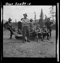 [Untitled photo, possibly related to:  Spring pulpwood drive on the Brown Company timber holdings in Maine. Mid-afternoon "lunch" by Long Pond where woodsmen are sluicing. On the menu that day: roast pork and dressing, boiled potatoes, turnips, baked beans, hot cakes, hot biscuits, bread, butter, cookies, apple pie, orange pie, milk, tea, coffee, water]. Sourced from the Library of Congress.