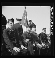 [Untitled photo, possibly related to: Gloucester, Massachusetts. Memorial Day, 1943. An aged member of the American Legion band resting after the parade]. Sourced from the Library of Congress.