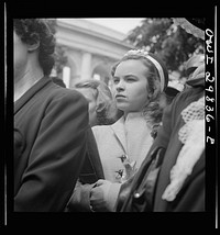 Arlington Cemetery, Arlington, Virginia. A girl watching Colonel Hammond lay the President's wreath on the Tomb of the Unknown Soldier on Memorial Day. Sourced from the Library of Congress.