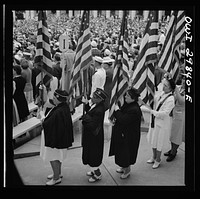 Arlington Cemetery, Arlington, Virginia. Color bearers marching into the amphitheater for Memorial Day services. Sourced from the Library of Congress.