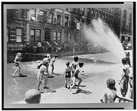 New York, New York. Children escape the heat of the East Side by using fire hydrant as a shower bath. Sourced from the Library of Congress.