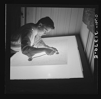 Washington, D.C. Preparing an advisory forecast at the U.S. Weather Bureau. A junior meteorologist assembling plotted sectional weather maps prior to analysis by forecasters. Sourced from the Library of Congress.