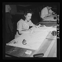 [Untitled photo, possibly related to: Washington, D.C. Preparing an advisory forecast at the U.S. Weather Bureau. Preparing an auxiliary weather map which reveals upper atmospheric conditions]. Sourced from the Library of Congress.