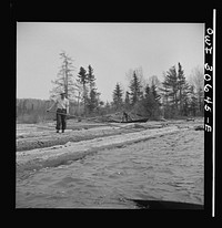 Spring pulpwood drive on the Brown Company timber holdings in Maine. Opening up an empty boom at the upper end of Mooselookmeguntic Lake so it can be filled with more logs from the Kennebago River. Sourced from the Library of Congress.