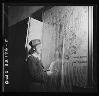 Washington, D.C. Miss Dorothy Lutz checking a map before she starts to deliver telegrams. Sourced from the Library of Congress.