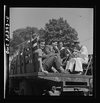 [Untitled photo, possibly related to: Oswego, New York. Hay ride for the United Nations heroes and Oswego girls during United Nations week]. Sourced from the Library of Congress.