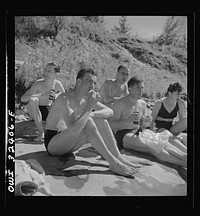 Oswego, New York. United Nations heroes eating a picnic lunch after swimming in Lake Ontario at a swimming party held for visitors' entertainment during United Nations week. Sourced from the Library of Congress.
