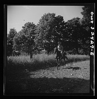 [Untitled photo, possibly related to: Oswego, New York. Polish naval officer riding a horse at a farm where the heroes were entertained during United Nations week]. Sourced from the Library of Congress.