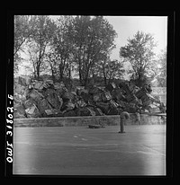 Scrap iron in a barge tied along the Ohio River bank. Sourced from the Library of Congress.