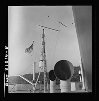 Derrick and pipes on the deck of the towboat Ernest T. Weir going down the Ohio River to Cincinnati. Sourced from the Library of Congress.