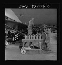 Bar Harbor, Maine. Civil Air Patrol base headquarters of coastal patrol no. 20. Replacing the cylinders in a plane after overhauling it. Sourced from the Library of Congress.