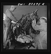 Bar Harbor, Maine. Civil Air Patrol base headquarters of coastal patrol no. 20. Plane engine receiving a routine overhaul in the hangar. Sourced from the Library of Congress.