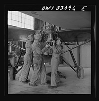 Bar Harbor, Maine. Civil Air Patrol base headquarters of coastal patrol no. 20. Replacing the cylinders in a plane after overhauling it. Sourced from the Library of Congress.