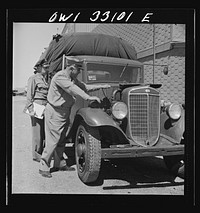 Bar Harbor, Maine. Civil Air Patrol base headquarters of coastal patrol no. 20. Major James B. King, base commander, on a routine inspection of all installations and equipment. Sourced from the Library of Congress.