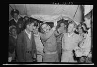 Lieutenant McArthur Powers, twenty-seven, of Inwood, New York, (left) and Lieutenant Richard E. Duffey, twenty-four, of Walled Lake, Michigan, at the 57th Fighter Group base somewhere in Tunisia after both men had become aces in a single engagement by destroying five enemy planes. Powers, who had been with the Royal Air Force at El Alamein, now has seven enemy planes to his credit. He had two with the Royal Air Force. Sourced from the Library of Congress.