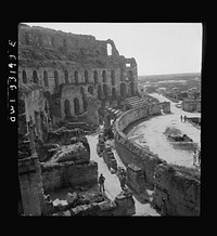 American troops of the 57th Fighter Group sightseeing among Roman ruins in Tunisia. Sourced from the Library of Congress.