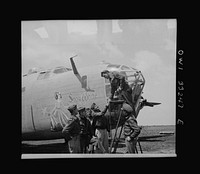 [Untitled photo, possibly related to: Snow White, a B-24 bomber of the U.S. Army 9th Air Force at a forward bomber base in the Libyan desert. Among its crew, there are four members who flew the ship across the Atlantic and piloted it through thirty-six missions, compiling 300 combat hours in the Middle East]. Sourced from the Library of Congress.