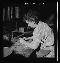 New Britain, Connecticut. Women employed at the Landers, Frary and Clark plant. Making core molds for food choppers to be used by the army. Sourced from the Library of Congress.