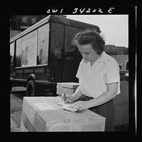New Britain, Connecticut. Mrs. Dorthy Bell, Irish-German descent, twenty-seven years old, mother of two children, employed at the American Railway  Express Company, sorting packages, weighing them, etc., earns seventy-nine and one-half cents per hour. Sourced from the Library of Congress.