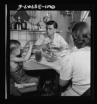 [Untitled photo, possibly related to: Middle River, Maryland. A FSA (Farm Security Administration) housing project for Glenn L. Martin aircraft workers. A worker's family in their trailer home]. Sourced from the Library of Congress.