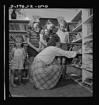 Middle River, a small crossroads in the vicinity of Baltimore, Maryland. FSA (Farm Security Administration) housing project (later administered by the National Housing Agency) for Glenn L. Martin aircraft workers. At the children's library. Sourced from the Library of Congress.