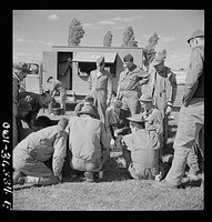 [Untitled photo, possibly related to: Constantine (vicinity), Algeria. Red Cross clubmobile serving refreshments to an anti-aircraft gun crew stationed in an outlying post]. Sourced from the Library of Congress.