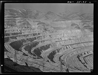 [Untitled photo, possibly related to: Bingham Canyon, Utah. Looking over the main canyon toward part of the west side operations, seen from the top of an office building]. Sourced from the Library of Congress.