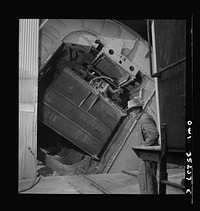 [Untitled photo, possibly related to: Magna, Utah. A rotary car dumper discharging copper ore at the mill]. Sourced from the Library of Congress.