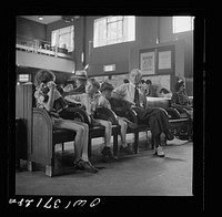 [Untitled photo, possibly related to: Pittsburgh, Pennsylvania. Passengers in the waiting room of the Greyhound bus station]. Sourced from the Library of Congress.