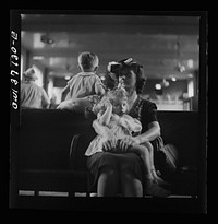 [Untitled photo, possibly related to: Pittsburgh, Pennsylvania. Passengers in the waiting room of the Greyhound bus station]. Sourced from the Library of Congress.