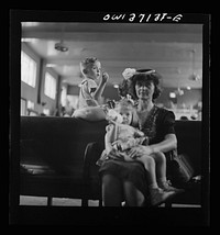 [Untitled photo, possibly related to: Pittsburgh, Pennsylvania. Passengers in the waiting room of the Greyhound bus station]. Sourced from the Library of Congress.