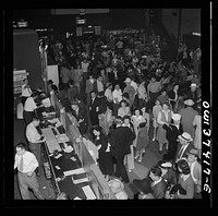 Pittsburgh, Pennsylvania. A crowd buying tickets at the Greyhound bus terminal. Sourced from the Library of Congress.