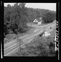 A railroad crossing on the bus route between Columbus and Cincinnati, Ohio. Sourced from the Library of Congress.