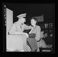 Chicago, Illinois. Private D.N. Danielson, stationed in North Carolina, and Mrs. Danielson, from Minnesota, in the waiting room of the Greyhound bus terminal. They met in Chicago to save time for his furlough. Sourced from the Library of Congress.