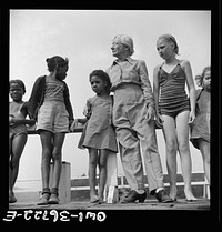 Haverstraw, New York. Interracial activities at Camp Christmas Seals, where children are aided by the Methodist Camp Service. Mrs. Addie C. Cox, director, the "mother" of all the campers. Sourced from the Library of Congress.