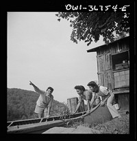 Arden, New York. Interracial activities at Camp Gaylord White, where children are aided by the Methodist Camp Service. Launching a canoe. Sourced from the Library of Congress.