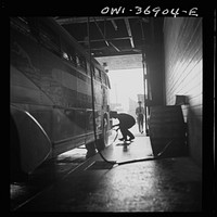[Untitled photo, possibly related to: Pittsburgh, Pennsylvania. A bus serviceman washing a bus which has just come in from a run in the Greyhound garage]. Sourced from the Library of Congress.