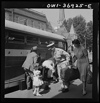 Passengers leaving a Greyhound bus in a small town in Pennsylvania. Sourced from the Library of Congress.