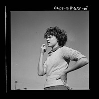 Washington, D.C. Listening to the teacher's instructions in a physical education class at Woodrow Wilson High School. Sourced from the Library of Congress.