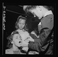 Washington, D.C. Student having her teeth examined, an annual procedure at Wilson High School. Sourced from the Library of Congress.
