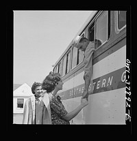 A Greyhound bus trip from Louisville, Kentucky, to Memphis, Tennessee, and the terminals. Saying goodbye at small town near Rome, Georgia. Sourced from the Library of Congress.