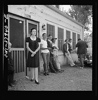 A Greyhound bus trip from Louisville, Kentucky, to Memphis, Tennessee, and the terminals. Idlers in front of the bus stop between Memphis and Chattanooga. Sourced from the Library of Congress.