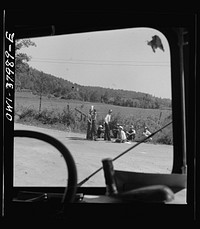 A Greyhound bus trip from Louisville, Kentucky, to Memphis, Tennessee, and the terminals. Men sitting by road side on Sunday afternoon, between Memphis and Chattanooga. Sourced from the Library of Congress.