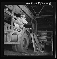 Bus trip from Knoxville, Tennessee, to Washington, D.C. Working on an old type coach which is being completely rebuilt at the garage of the Tennessee Coach Company in Knoxville, Tennessee. Sourced from the Library of Congress.