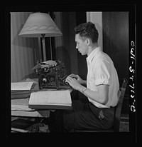 Washington, D.C. Walter Spangenberg, a student at Woodrow Wilson High School, doing his school work at home. Sourced from the Library of Congress.