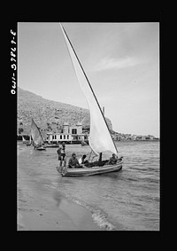 Boys with their sailboat in Sicily. The people are now seeking normal outlets for enjoyment. Sourced from the Library of Congress.