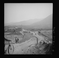 Repairing Sicilian roads demolished by the Germans in retreat. Sourced from the Library of Congress.