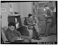 Washington, D.C. In the library at the United Nations service center. Boys are urged to take books back to camp with them. Sourced from the Library of Congress.